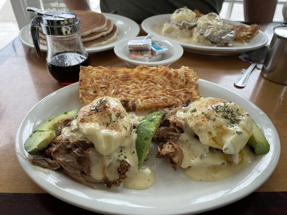 Breakfast plates and coffee on a café menu.